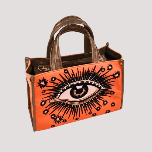 La Funky Mexicana La Grande Velvet Bag in orange aus Samt und veganem Leder, Handtasche mit ikonischem Augenmotiv, Frontansicht leicht schräg
